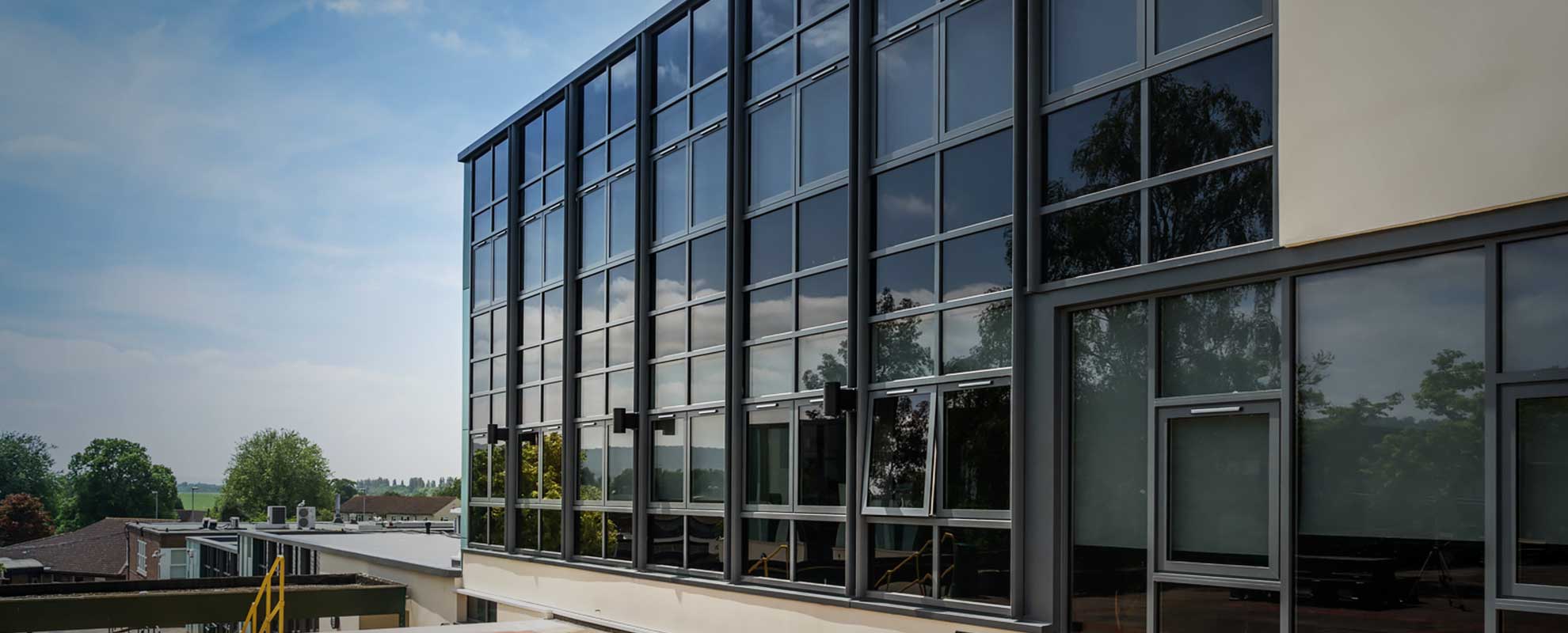 Black aluminium curtain wall with tinted glass