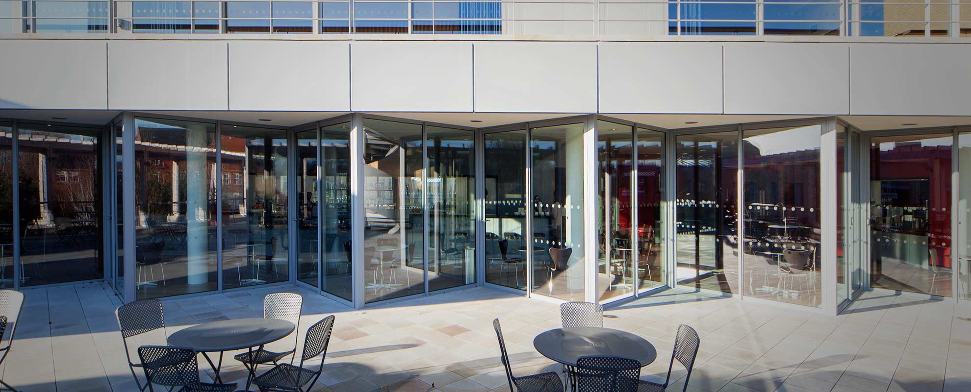 Aluminium patio doors arranged in zig zag pattern