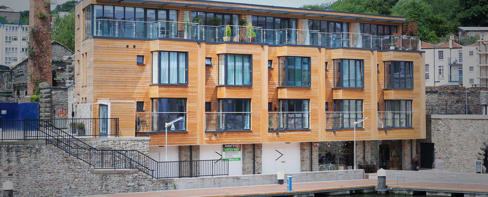 Tall tilt and turn windows that act as doors onto the apartment balcony